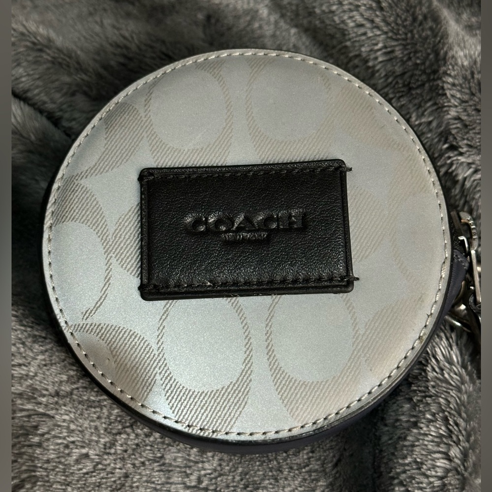 Coach reflective round pouch